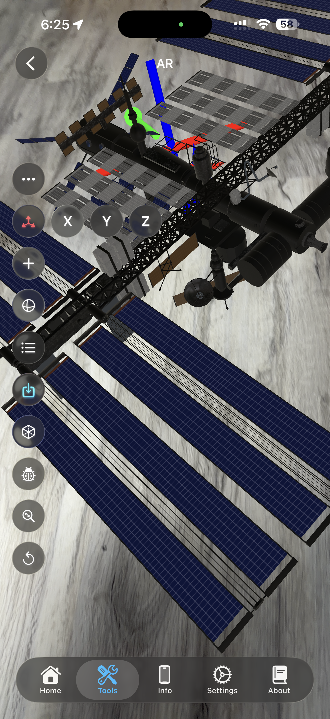 ISS 3D model placed in AR with move mode active showing X, Y, Z axis controls